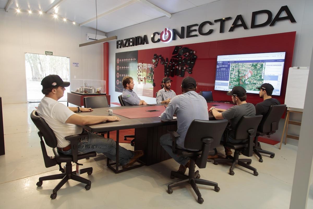people sitting together around a conference table