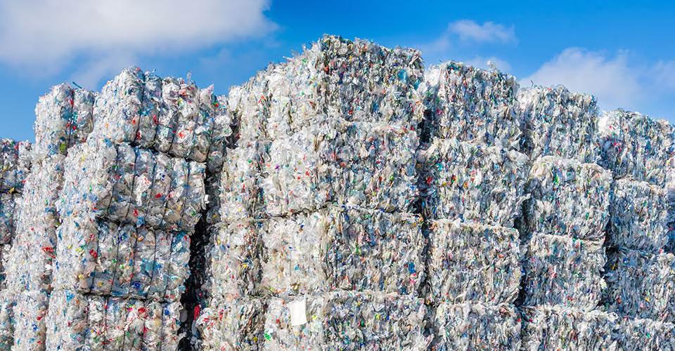 Stacks of bailed plastics for recycling.