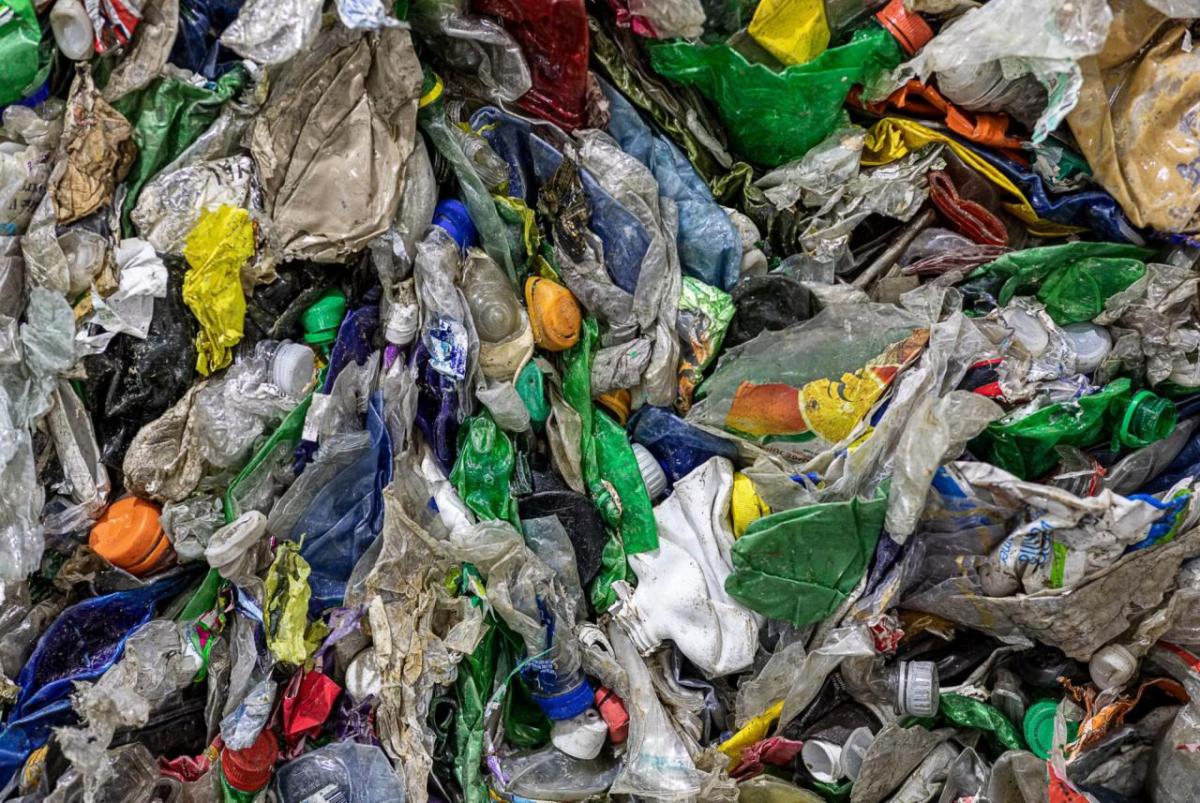 Close up of a pile of flattened plastic containers.