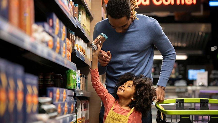 Father and child shopping in grocery store
