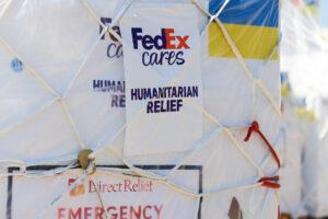 close up of netted crate with a tag "FedEx cares, humanitarian relief"