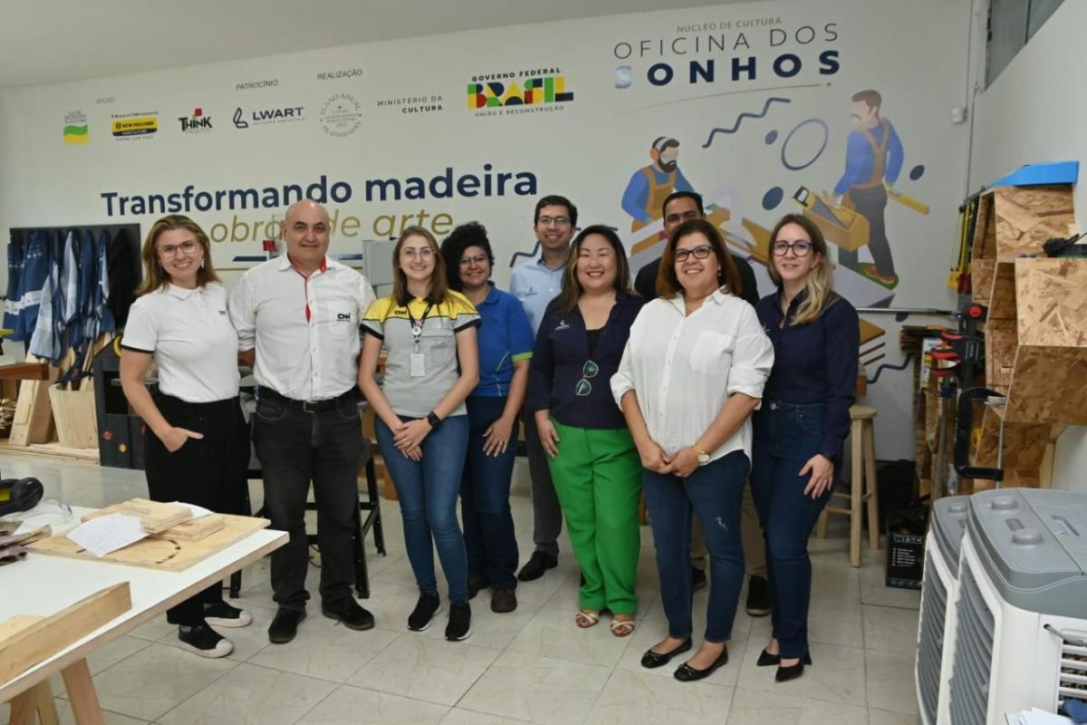 A group of people posed in a workshop