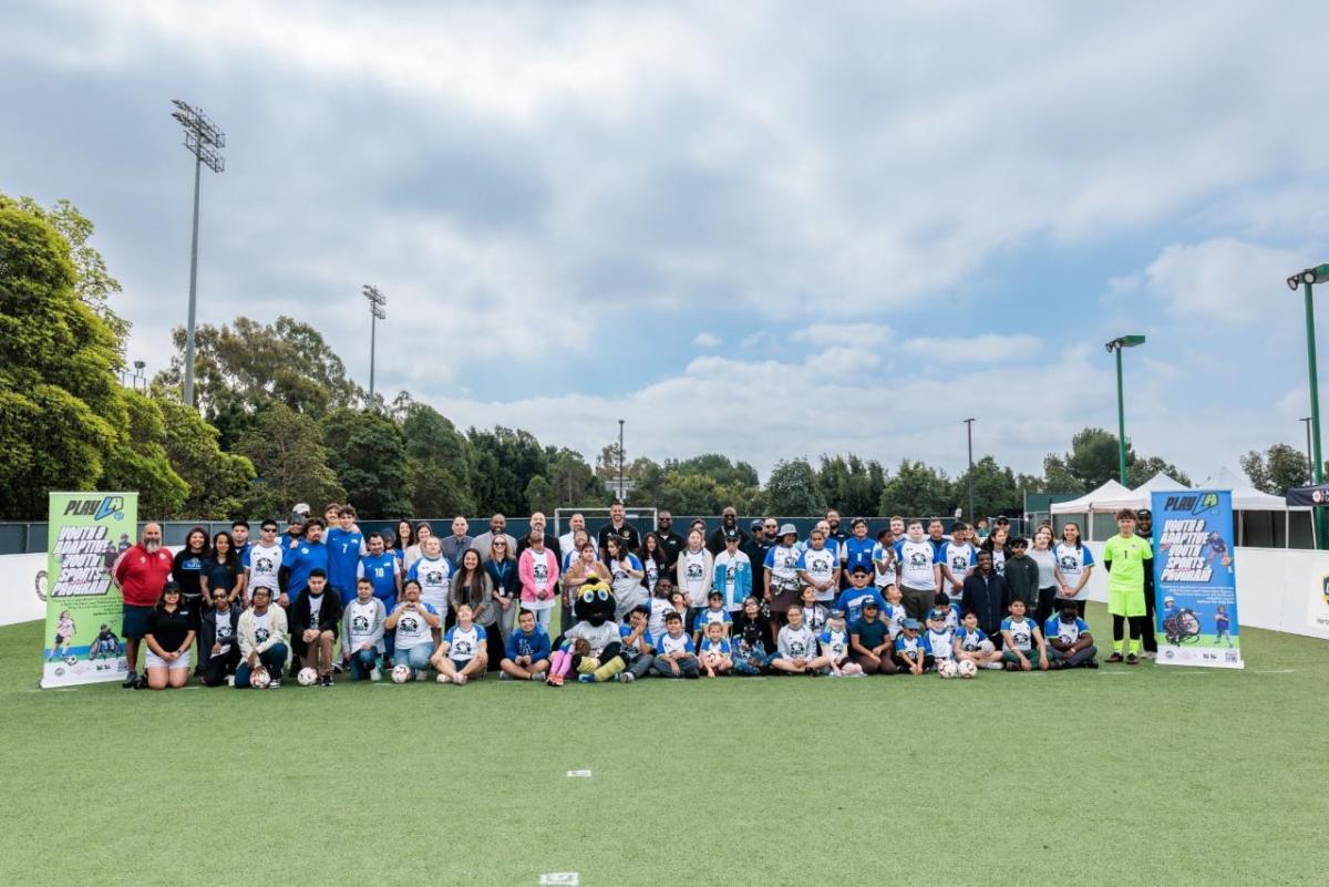 Athletes, families, LA Galaxy staff, and community partners gather for a group photo during the LA Galaxy Foundation Youth Adaptive Sports Program, which expands access to soccer and creates inclusive opportunities for youth athletes.