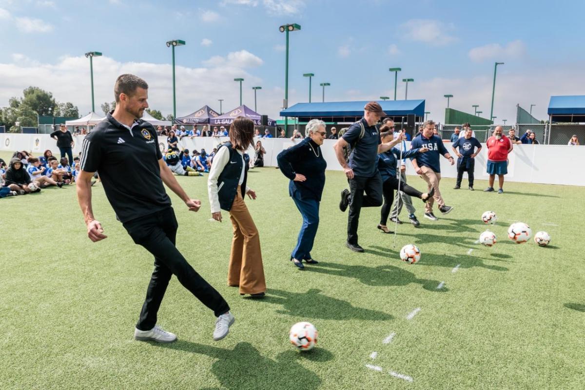 Community leaders and LA Galaxy representatives participate in a ceremonial kickoff during the Youth Adaptive Sports Program, celebrating the program’s mission to create inclusive sports experiences for athletes of all abilities.