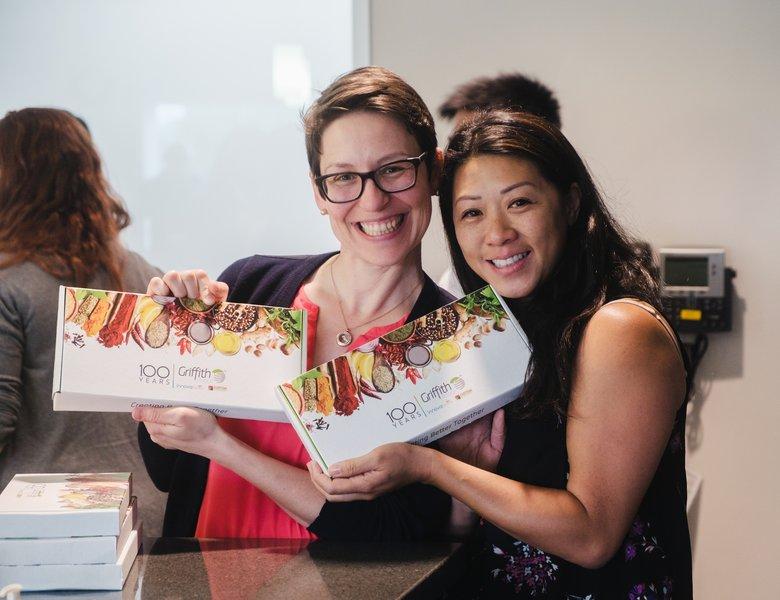 Griffith Foods employees with spices giveaways at the company's 100th anniversary celebration.
