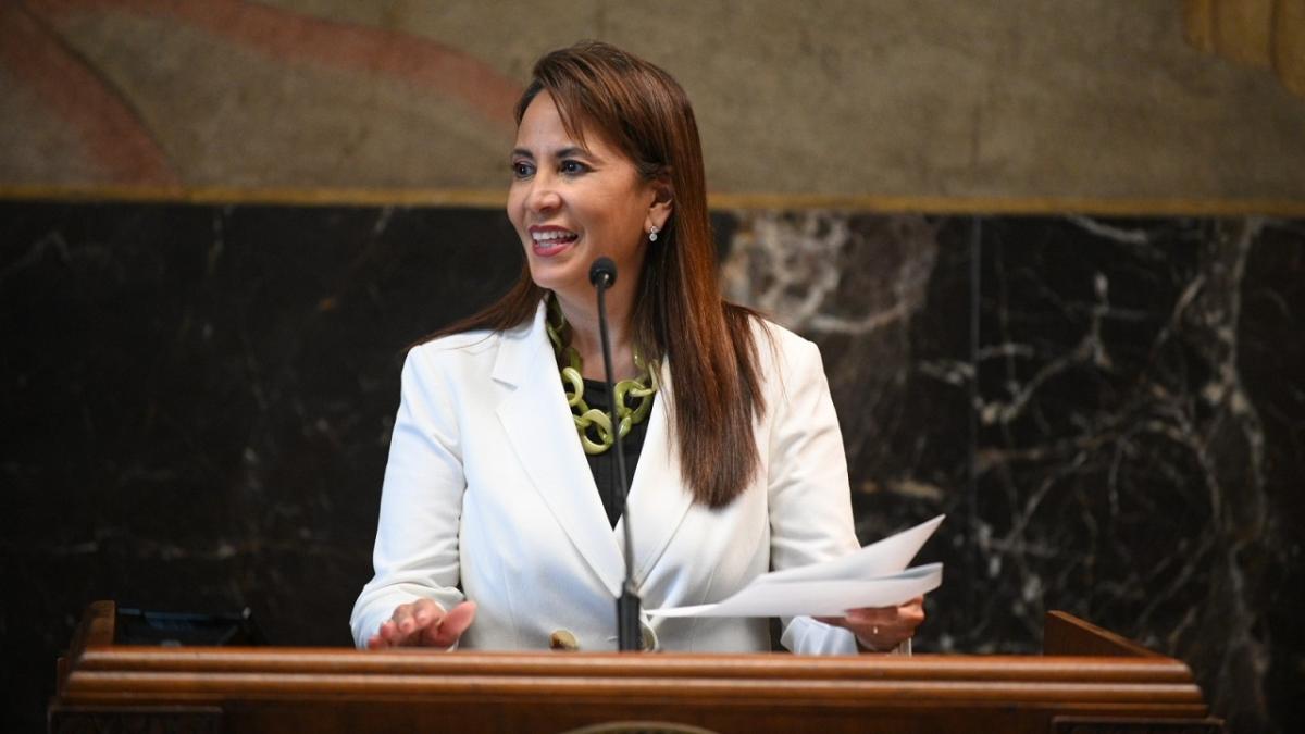 Patty Riddlebarger speaking at a podium