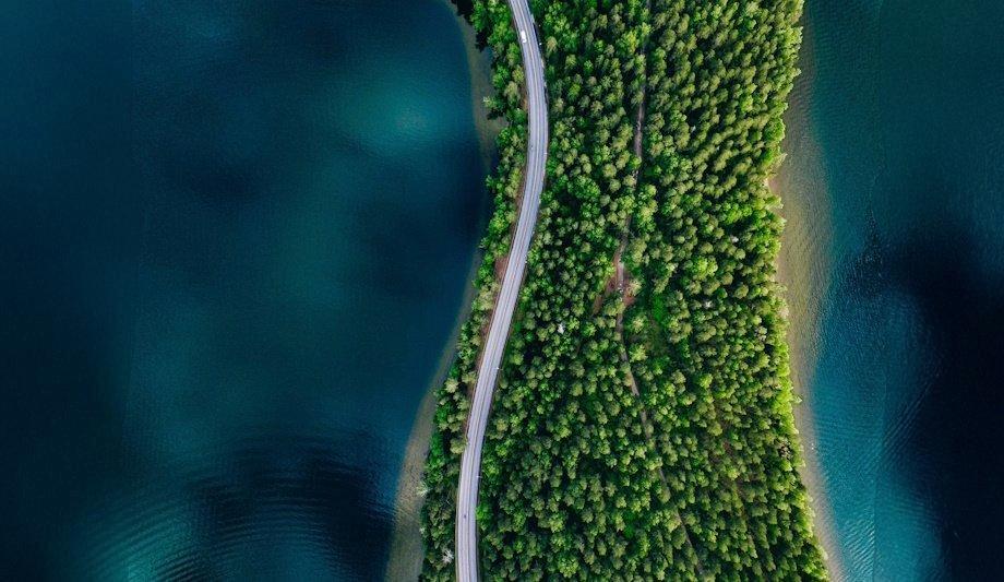 road on land in between water
