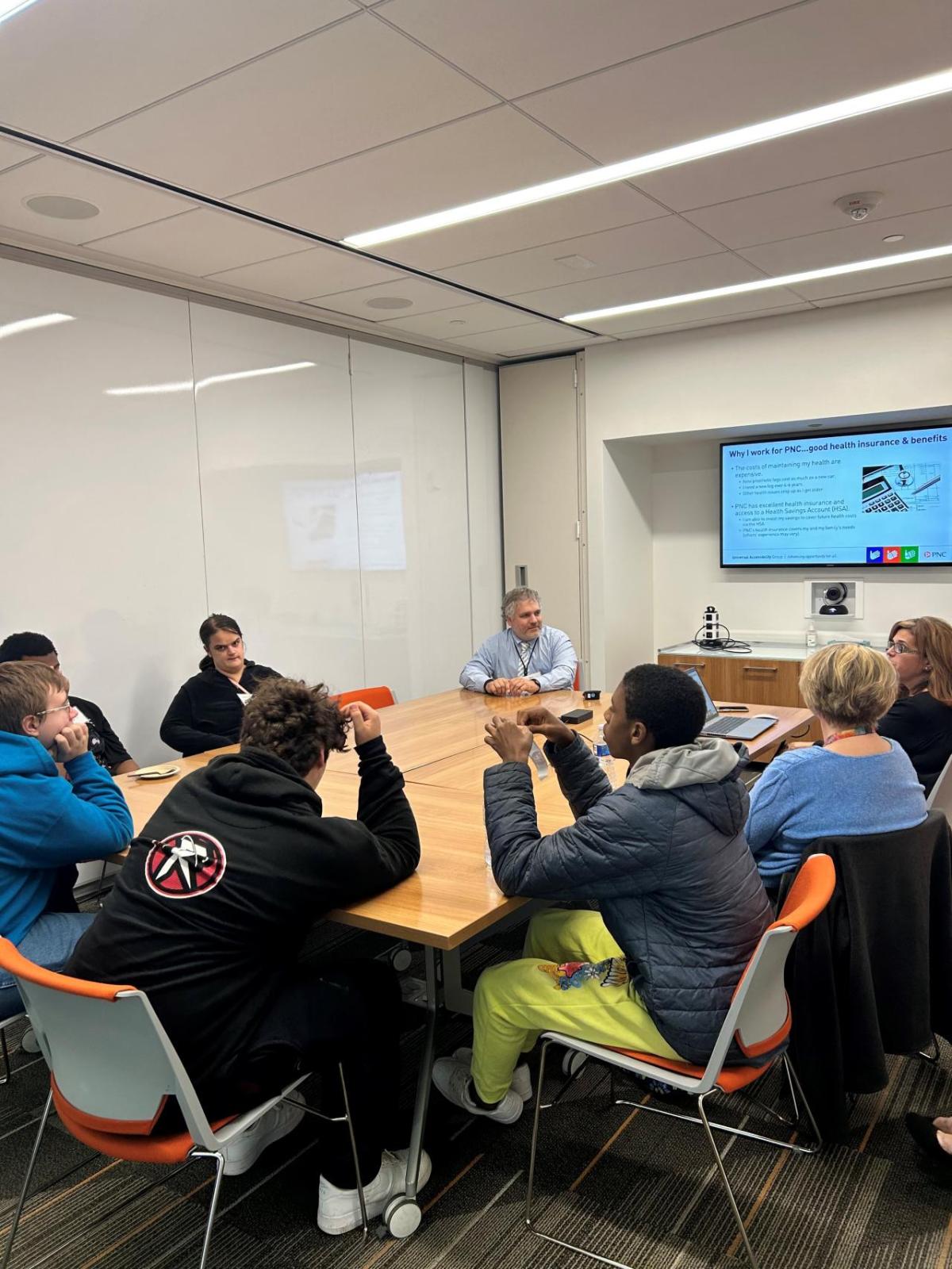 Rock Magleby-Lambert leads a session with Pittsburgh-area high school students at The Tower at PNC Plaza on Oct. 18, 2023, for Disability Mentoring Day " "