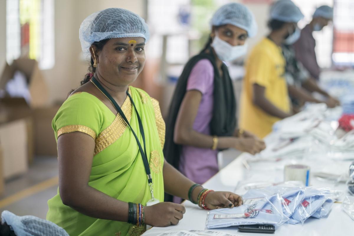 Fair trade factory workers on a clothing assembly line