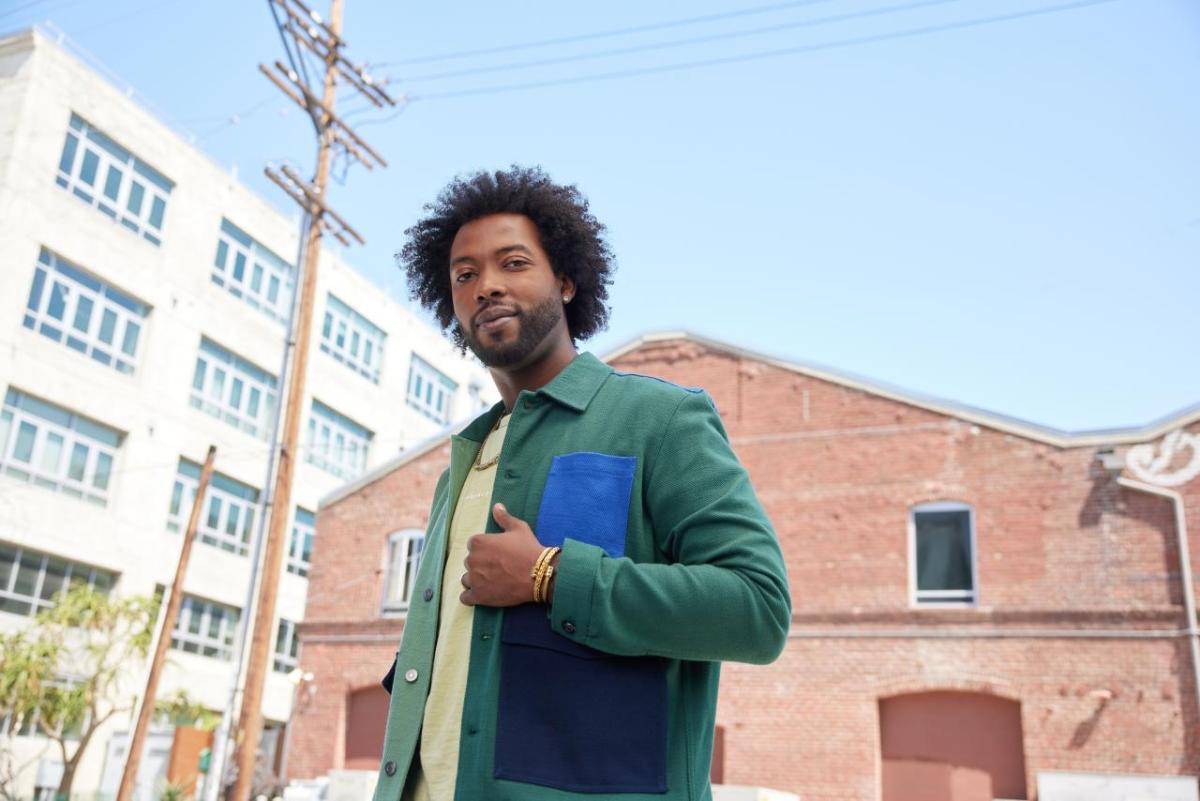 man standing in front of a building