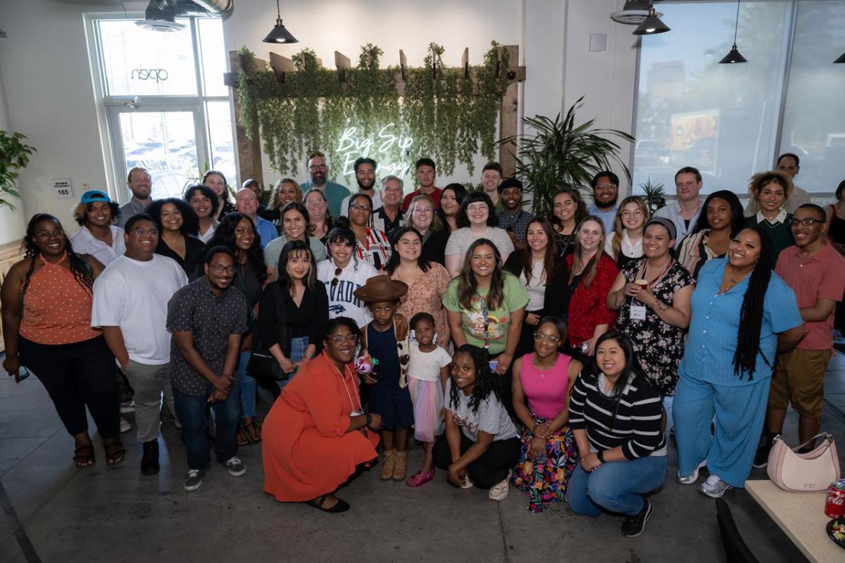 A large group of people smiling for the camera
