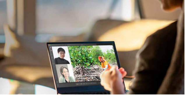 People in a meeting on a laptop screen