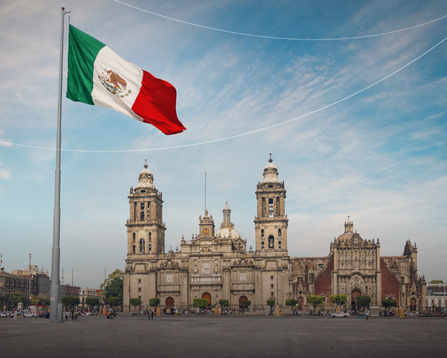 A flag flying in front of a building