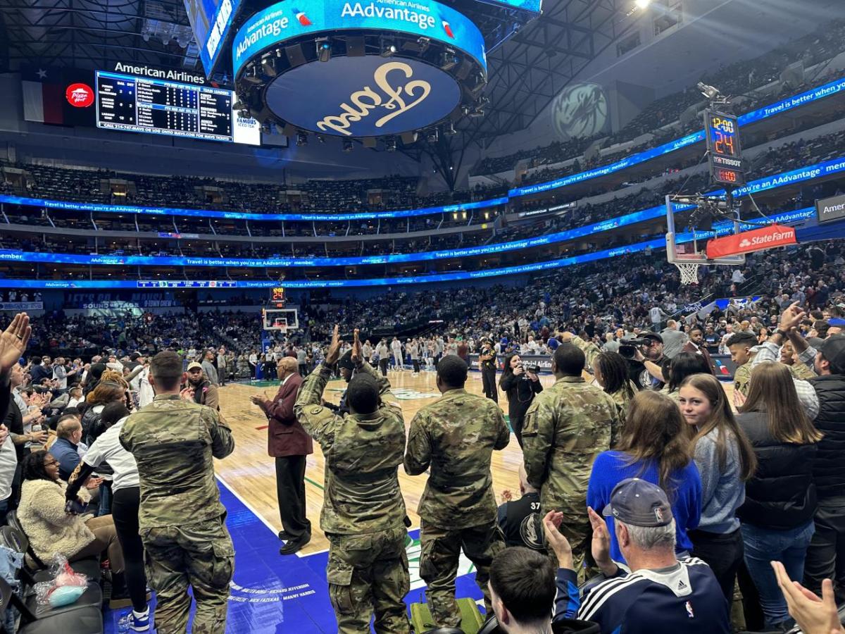 Soldiers cheering courtside