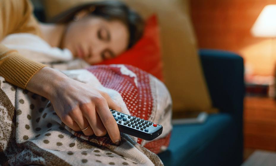 Person asleep with remote