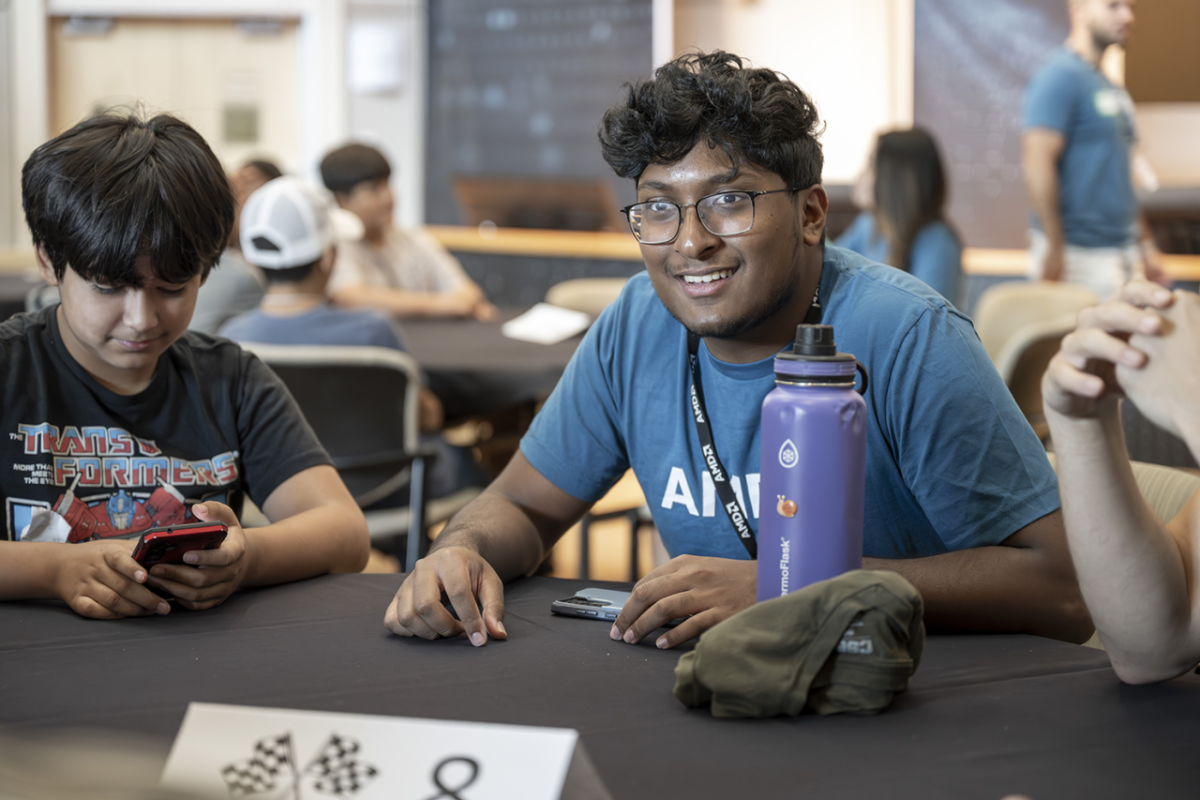 Students sitting at a table in a classroom