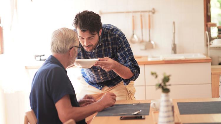 Alkermes' policies are designed to give employees autonomy to define the structure that will work for their individual responsibilities at home. Image courtesy of the Boston Business Journal person helping another drink soup
