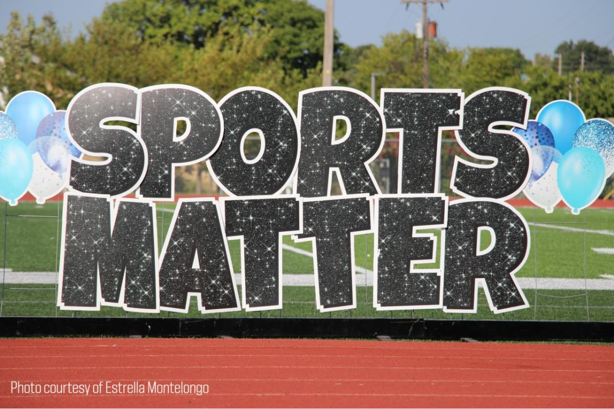 "Sports Matter" in digital lettering, background is a playing field and track.