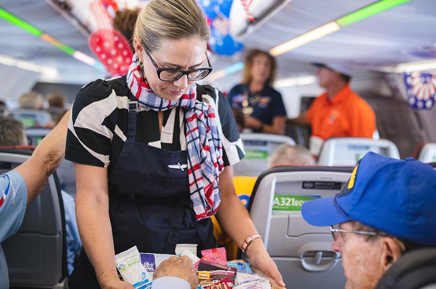 Person serves food to a passenger