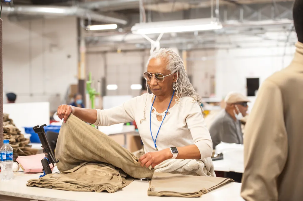 Someone folding fabric