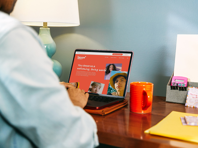 a person working at a desk on a laptop