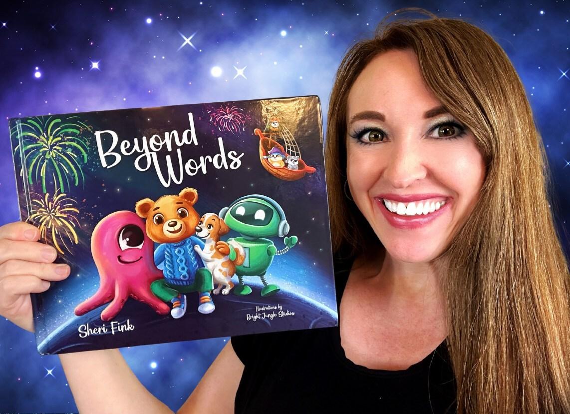 author holding up Beyond Words book cover