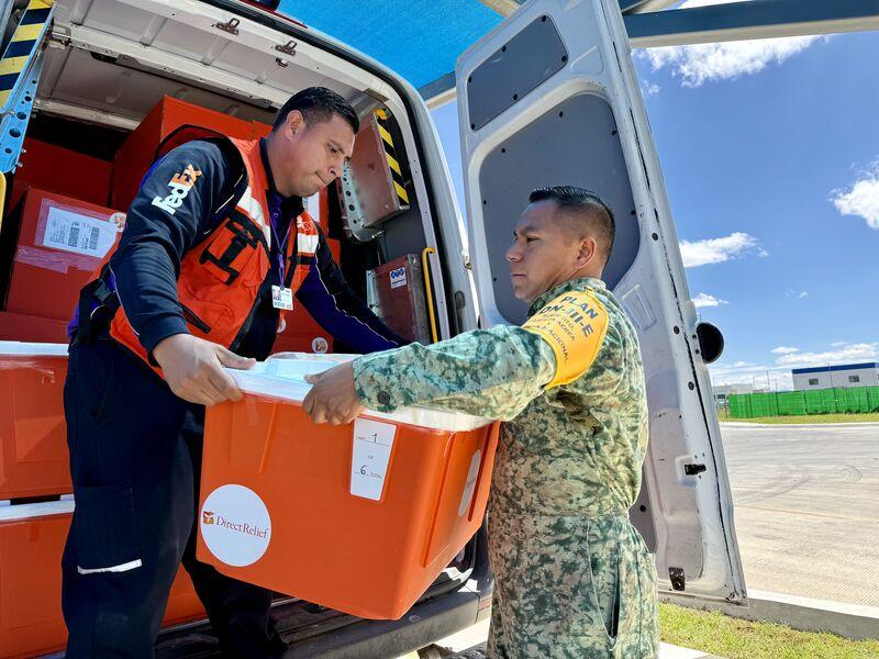 Loading supplies into a FedEx vehicle
