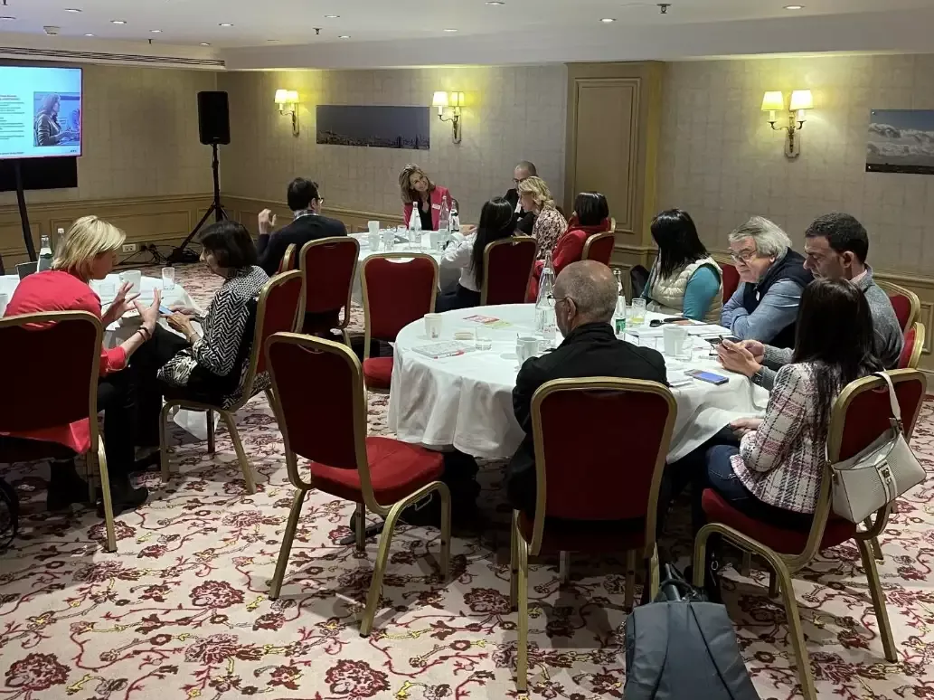 People sitting at tables at workshop