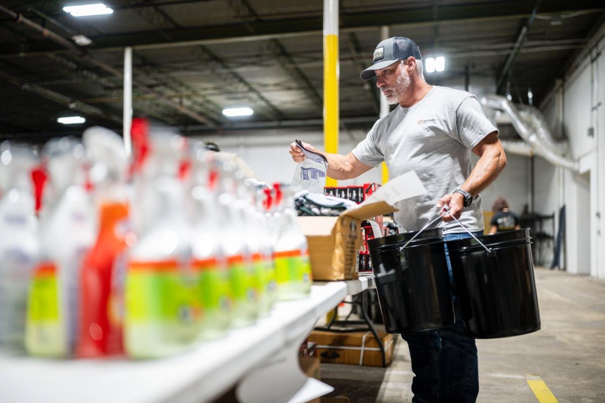 Southwire employee packing flood relief bucket