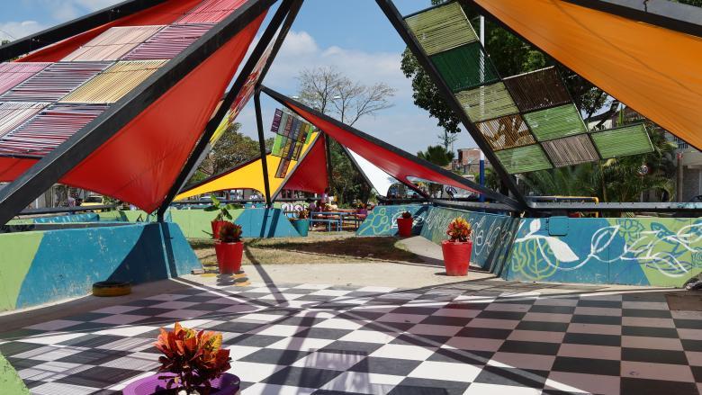 checkered flooring and triangular colorful fabric roof pieces