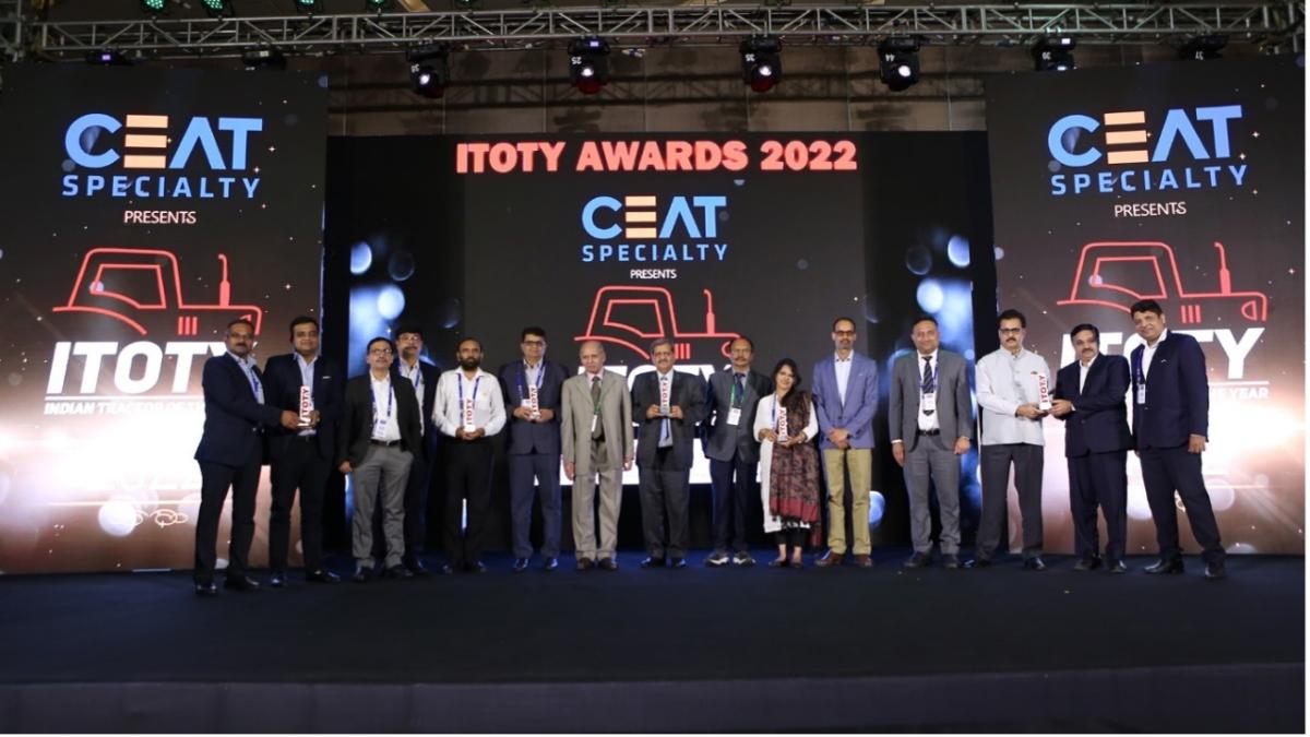 Award-winners pose with their trophies on stage at the Indian Tractor of the Year Awards 2022.