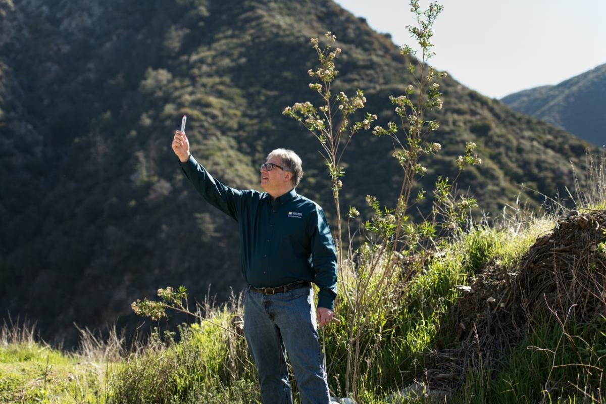 Tom Rolinski, SCE fire scientist, checks an anemometer to help determine wind speed near Mount Baldy.