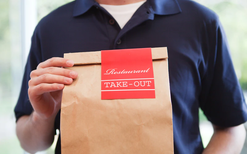 Person holding take-out order