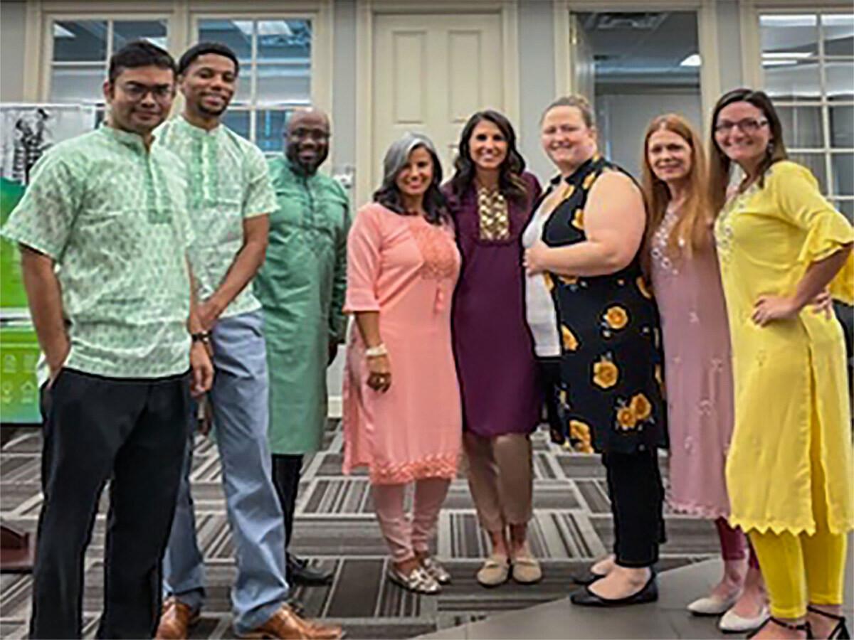 Group of employees wearing traditional clothing from Bangladesh