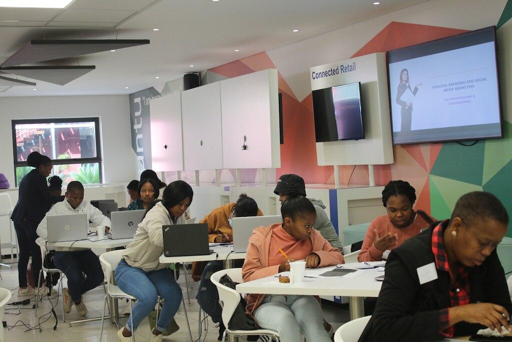 inside a classroom setting, students sitting in pairs