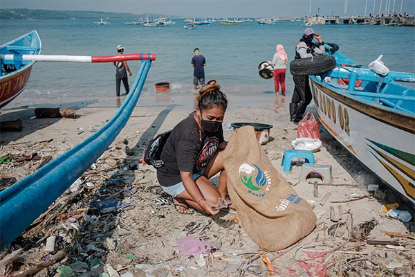 People cleaning up a beach