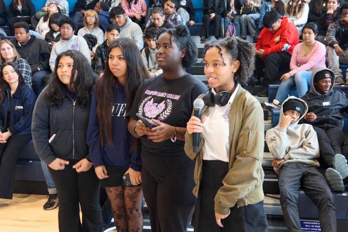 Students step forward to ask questions and share their interests during the interactive career panel, gaining firsthand insight into opportunities in sports and entertainment.