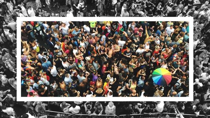 Image Courtesy of Paramount/Viacom aerial view of a large group of people tightly spaced. A square frame sections off a colored portion while outside the frame is black and white