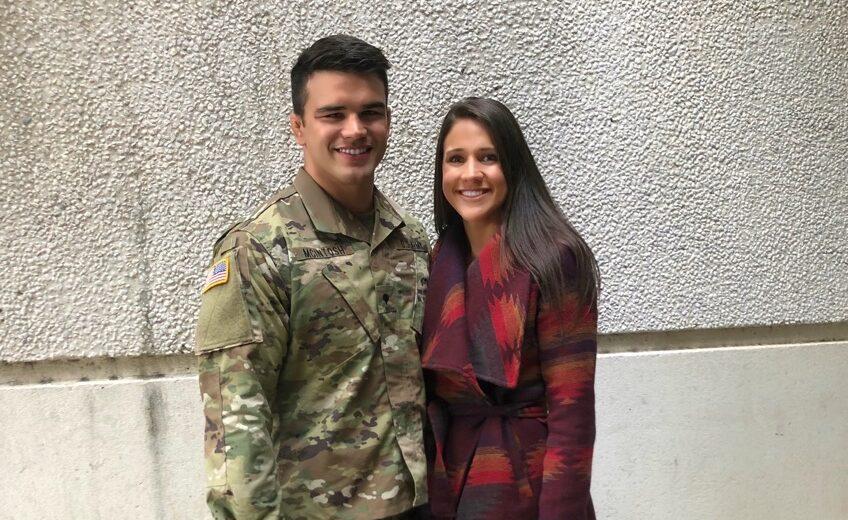 Morgan and Logan Mcintosh standing together smiling. Morgan in military uniform.