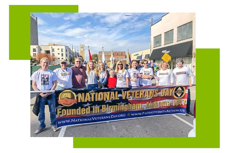 Group of people holding a Veterans day banner