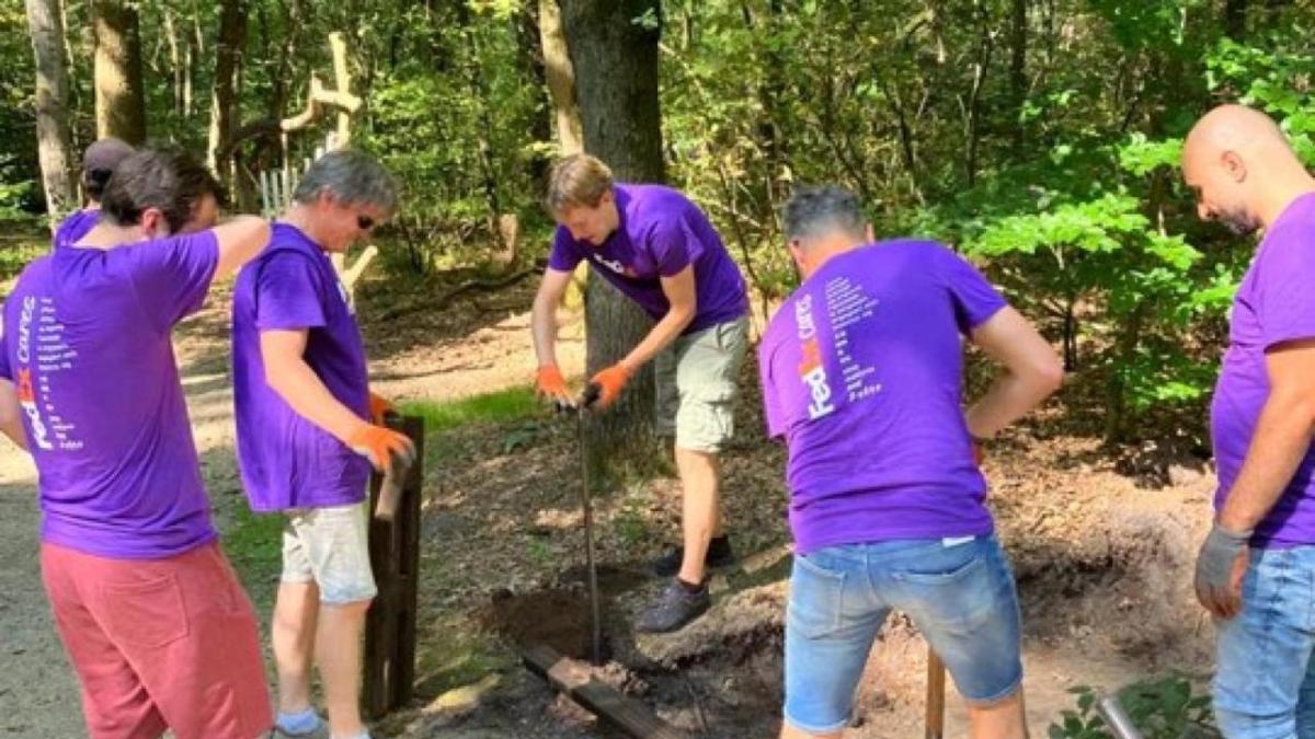 Volunteers doing landscaping work at a park.