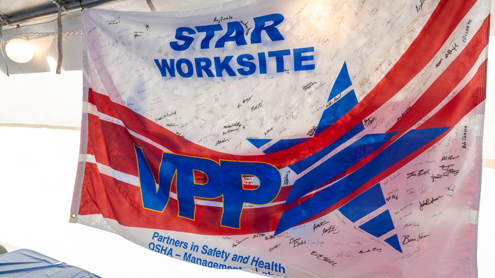 VPP Star worksite flag signed by all employees and contractors will be displayed at the refinery. Flag with "Star Worksite, VPP" on it