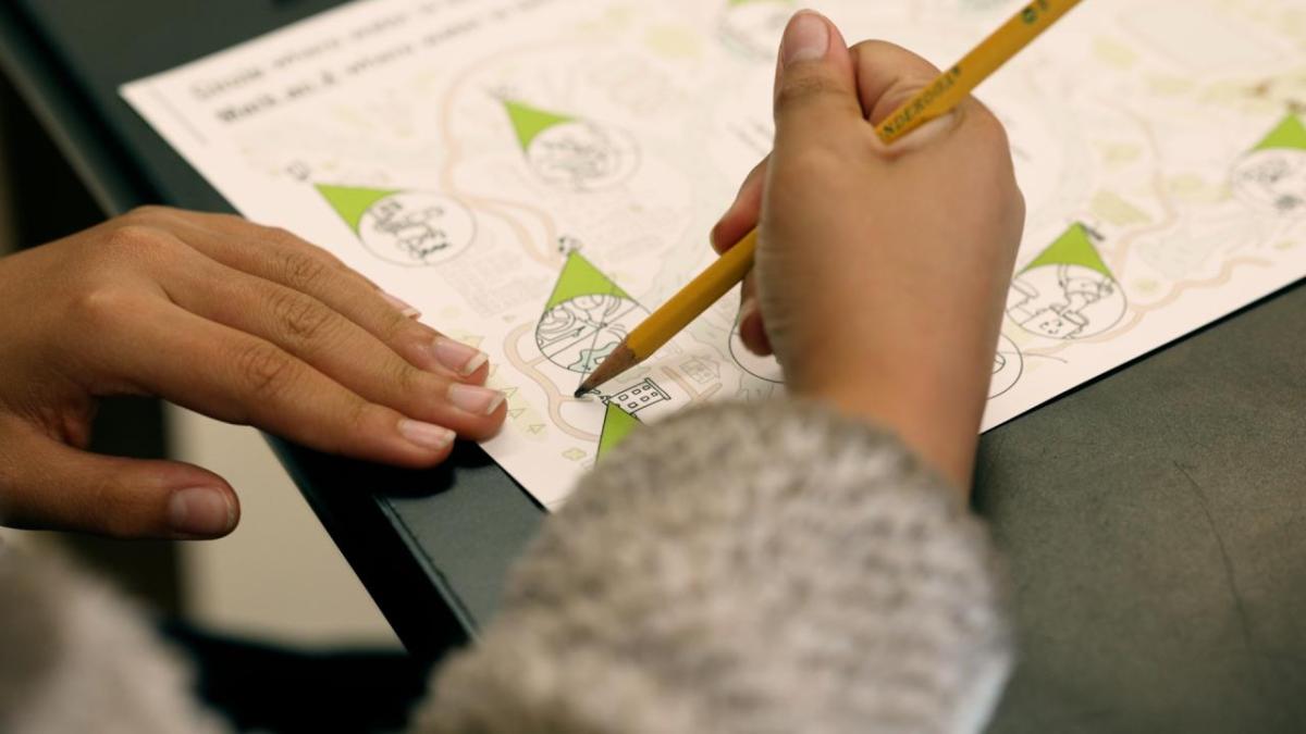 Child drawing on a piece of paper