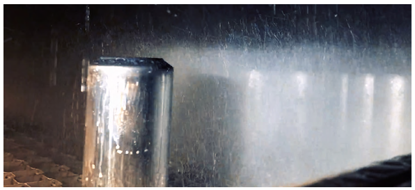A piece of metal being sprayed with water