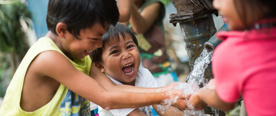Access to sustainable water can prevent a host of problems for needy regions of the world. Photo courtesy of Water.org. Kids playing in running water