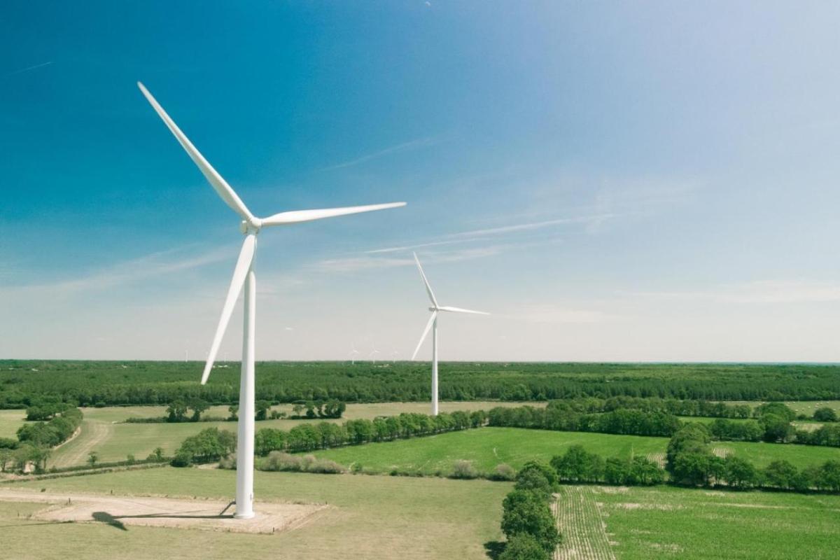 Wind turbines in an open area, clear sunny weather.