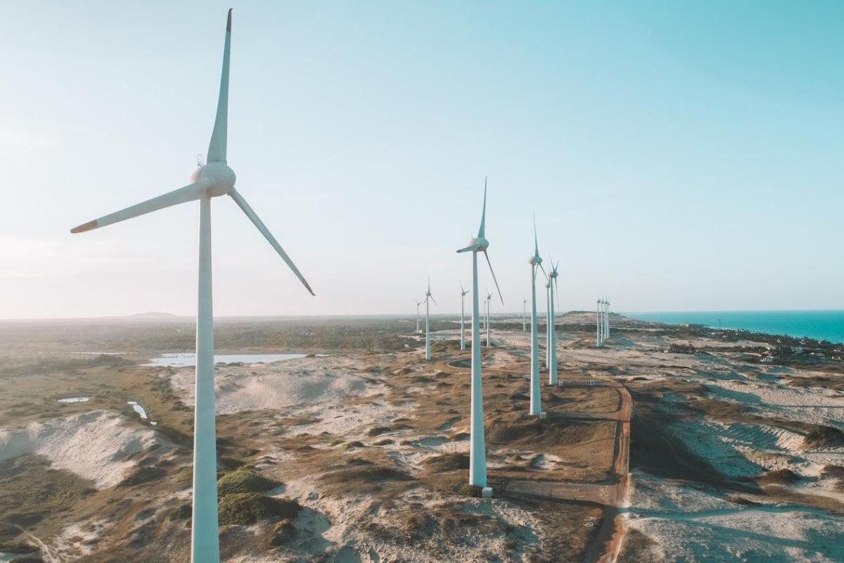 A row of wind turbines on desolate expanse of land