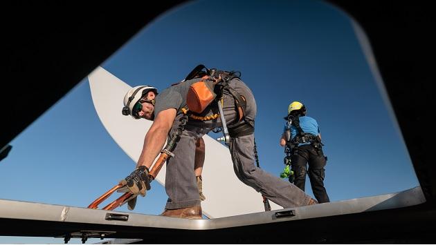 Enbridge employees at our Keechi Wind Project, a 110-megawatt (MW) wind farm in Jack County, TX. Two people working at the top of a wind turbine