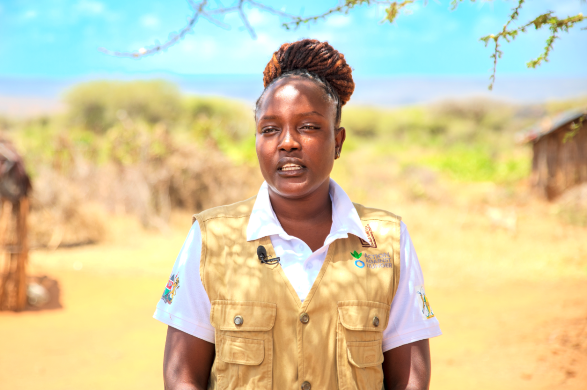Winne wears an Action Against Hunger vest and talks about her role. 