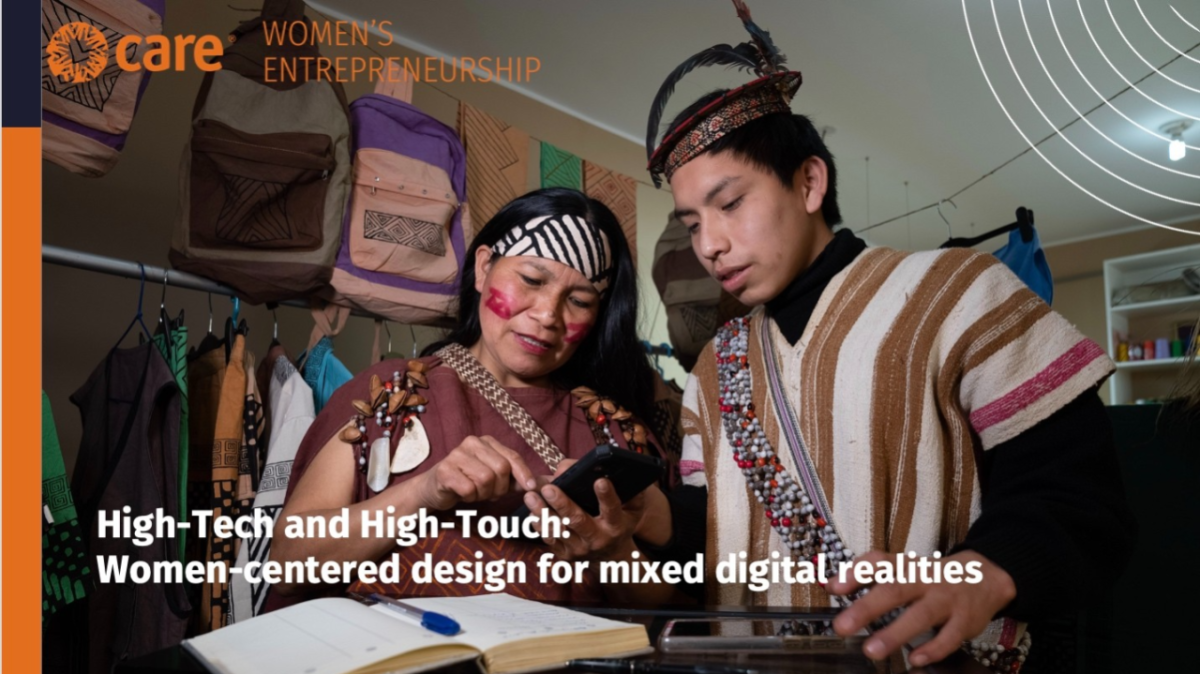 two people looking at a device in a shop, an open book on the table in front of them. "High-tech and High-touch: Women centered design for mixed digital realities."